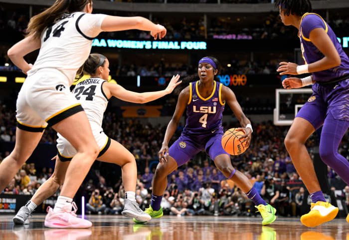 LSU’s Flau’jae Johnson dribbles past Iowa’s Gabbie Marshall in the NCAA women’s national championship game.